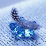 feather_and_gem_on_open_book_1920x1200