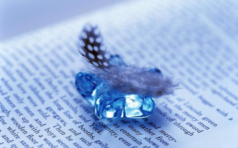 feather_and_gem_on_open_book_1920x1200