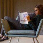 kid-reading-a-book-mockup-sitting-on-a-vintage-armchair-a19075