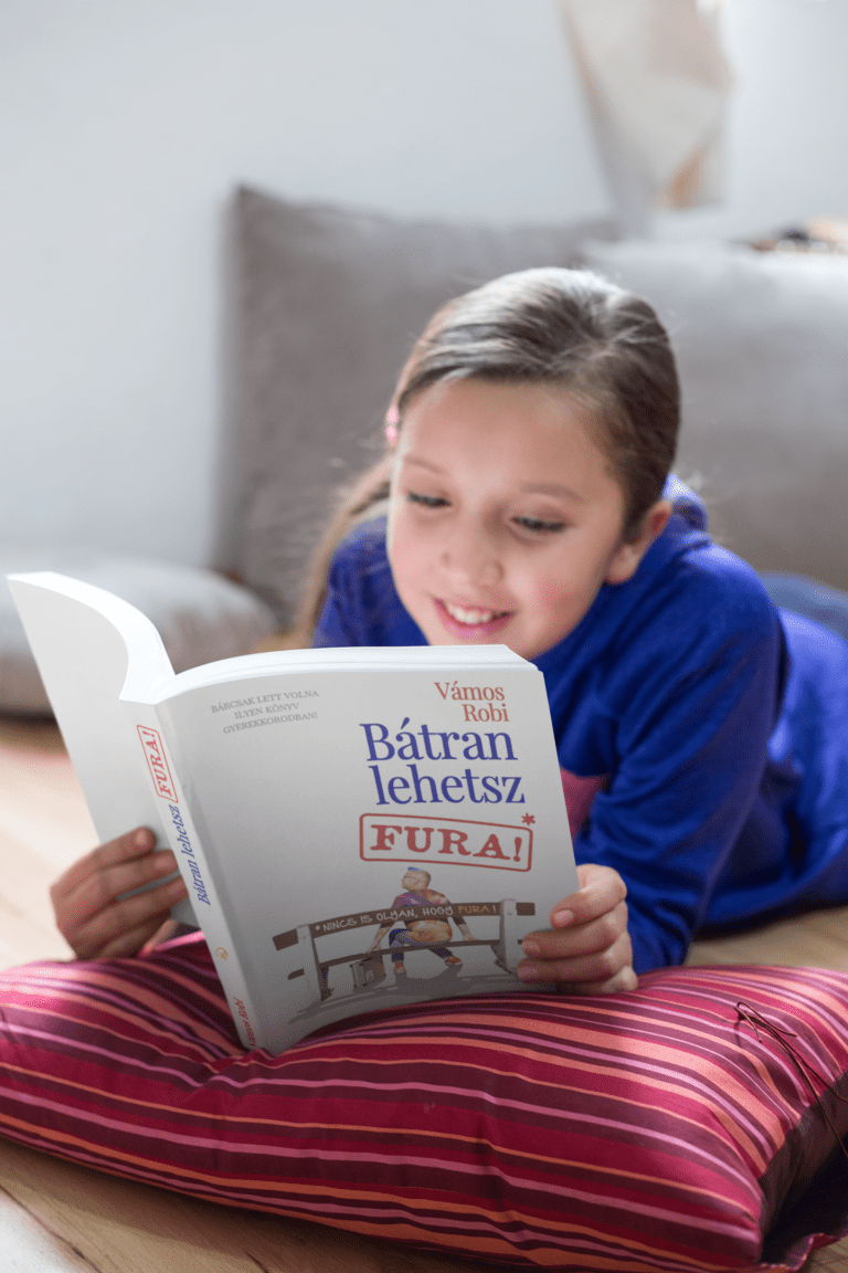 mockup-of-a-happy-girl-reading-a-book-while-on-the-floor-a19100