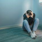 Unrecognizable woman with mental disorder and suicidal thoughts