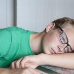 Portrait of teenage boy looking bored