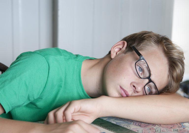 Portrait of teenage boy looking bored